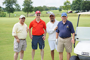 A team of four players at the 2017 golf tournament