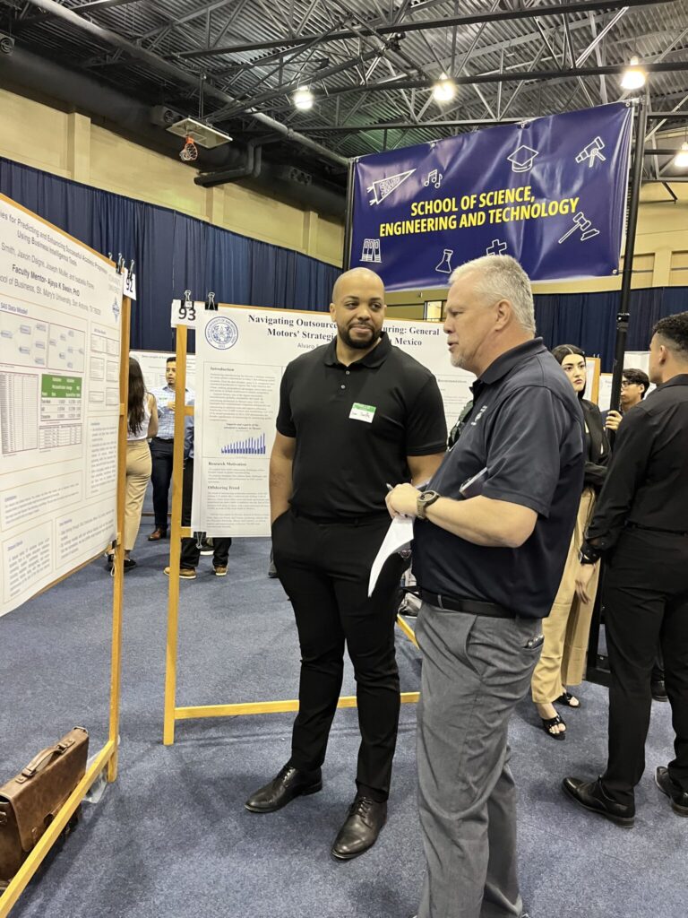 St. Mary's University Alumni judges presentation at the Research Symposium